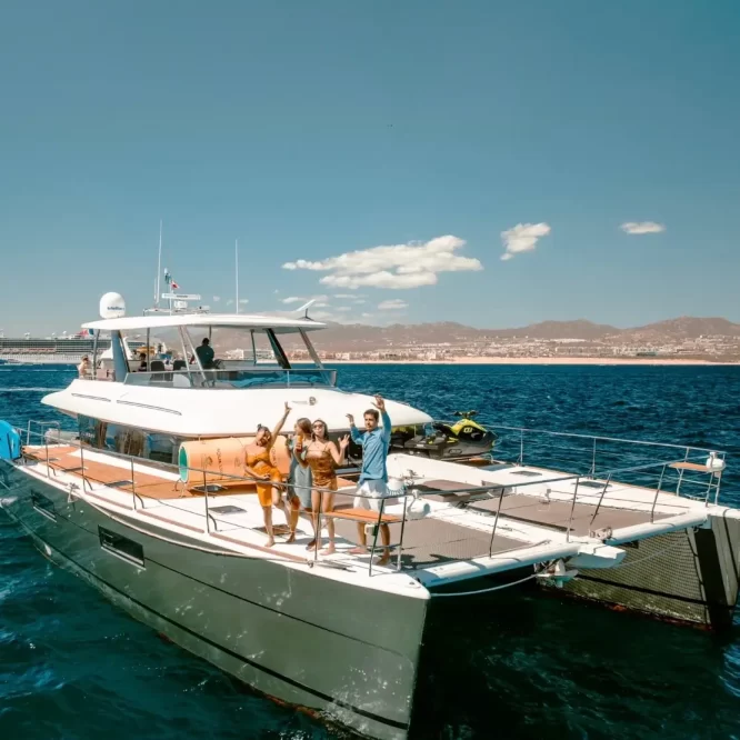 Drone photo of Lagoon 630 Power Catamaran sailing across Cabo San Lucas Luxury Yacht Rental Cabo San Lucas Ozean Luxe Charters